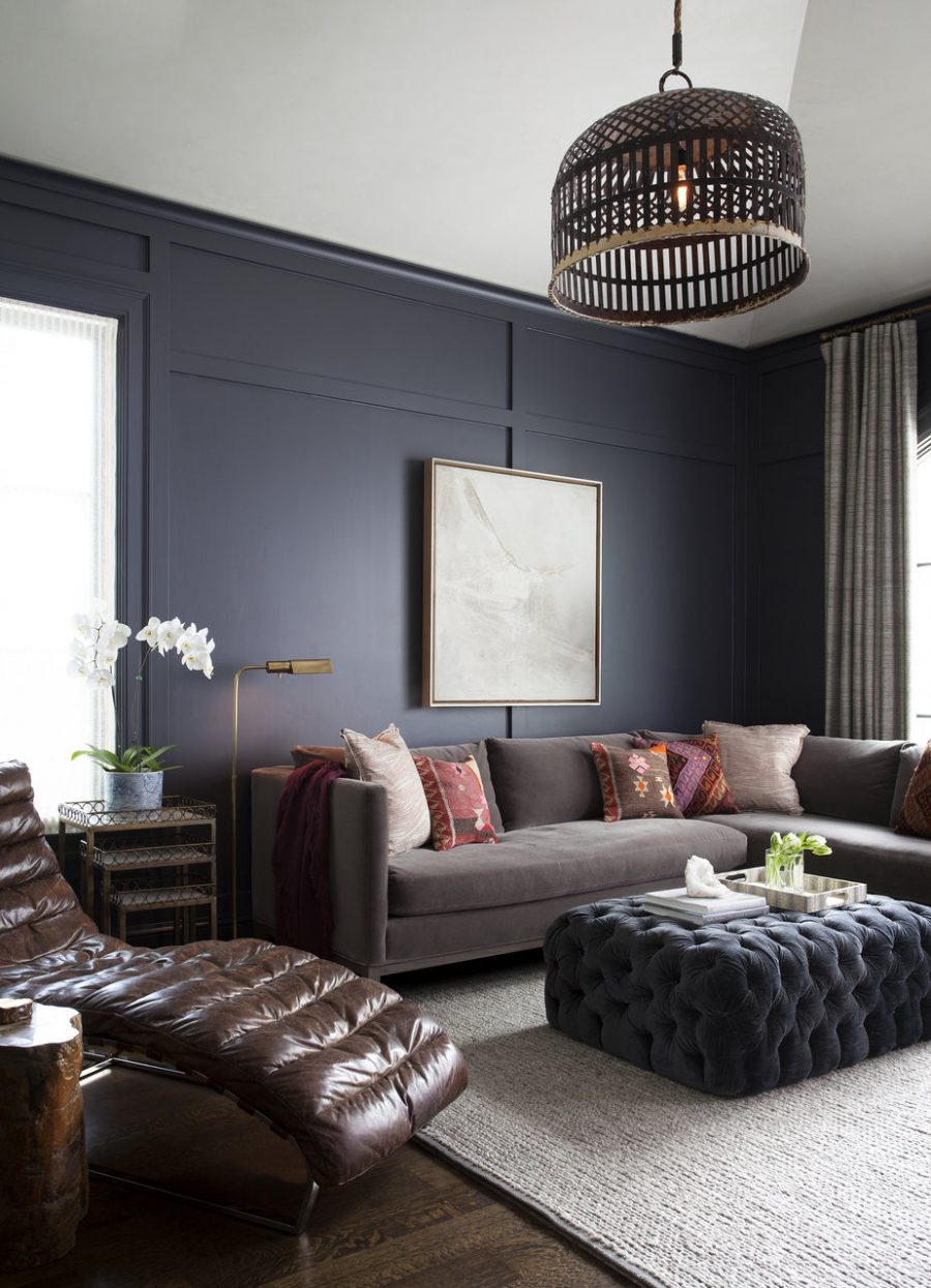 This dark masculine living room by Ryan Street and Associates gets
