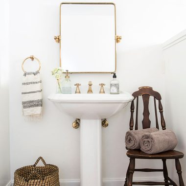 An easy, quick and cheap way to make a huge impact in updating a dark outdated bathroom | copycatchic home tour downstairs bath luxe living for less
