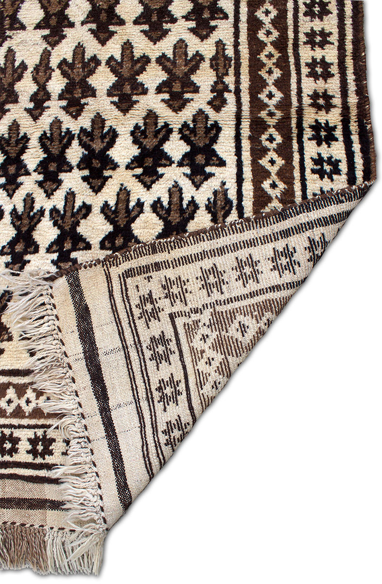 Copycatchic Arnow Rug vintage afghan undyed wool rug in ivory, brown and black.