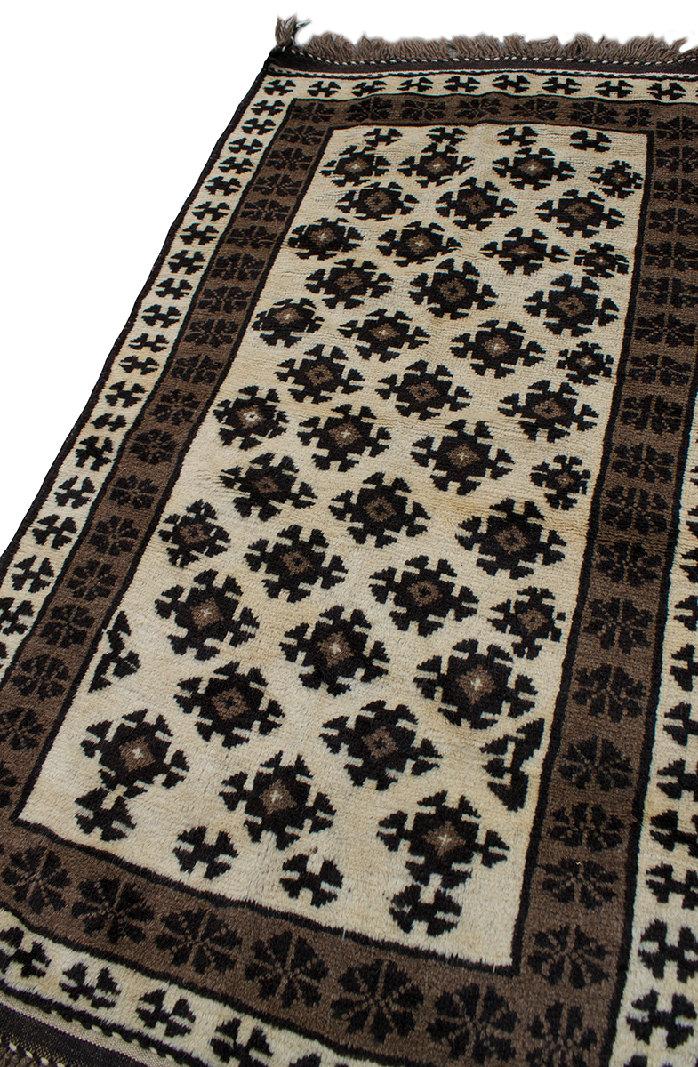 Copycatchic Crandall Rug vintage afghan undyed wool rug in ivory, brown and black.