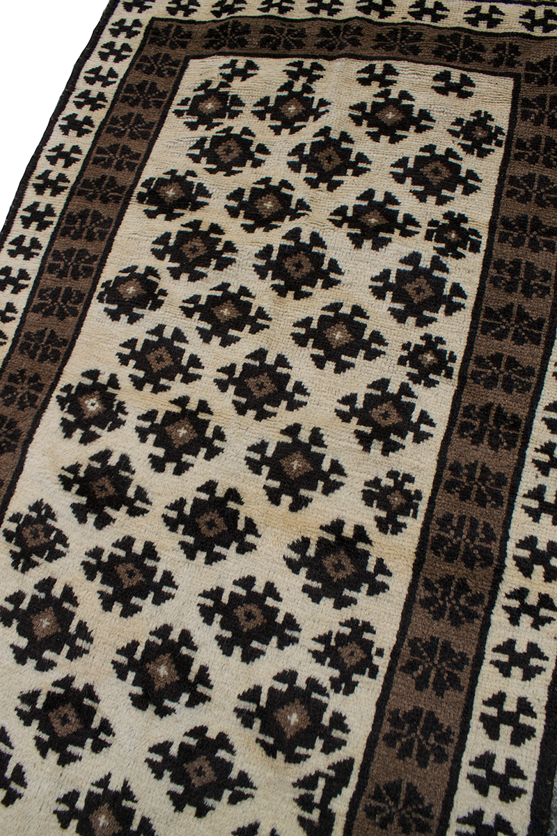Copycatchic Crandall Rug vintage afghan undyed wool rug in ivory, brown and black.