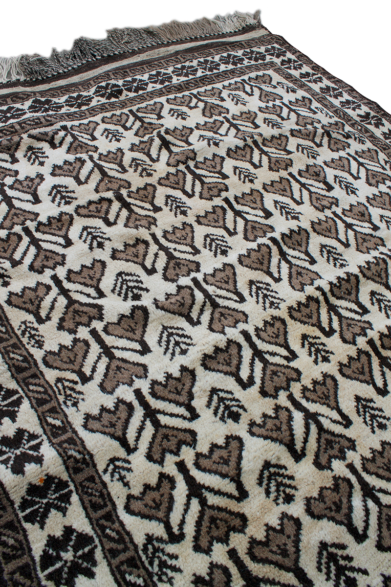 Copycatchic Emerson Rug vintage afghan tribal woven undyed wool rug in ivory, brown and black.