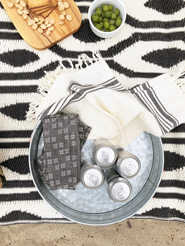 A minimalist, boho beach picnic for Mother's Day with World Market and copycatchic. Bohemian and ecclectic with ethnic accents combined with neutral textures like macramé and mudcloth prints. copycatchic luxe living for less budget home decor and design daily finds and room redos